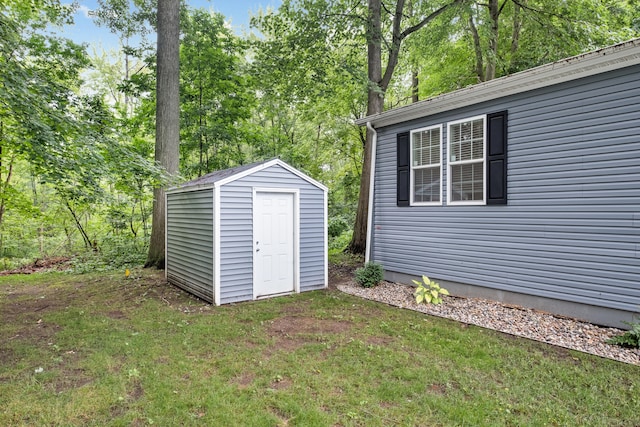 view of outdoor structure featuring a lawn