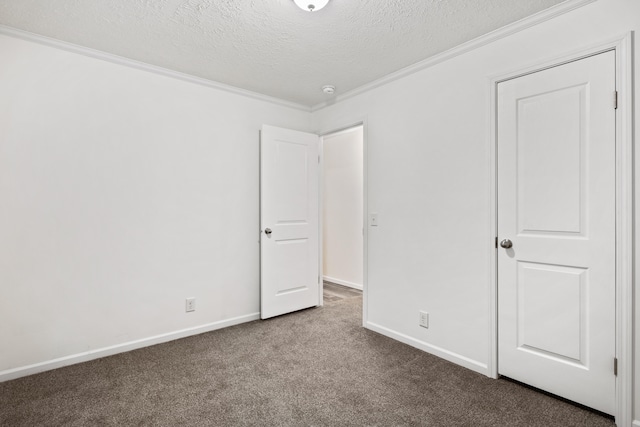 unfurnished bedroom with carpet flooring, crown molding, and a textured ceiling