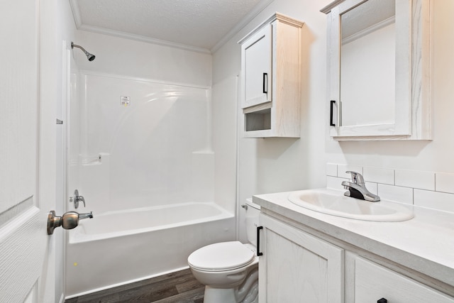 full bathroom with a textured ceiling, toilet, vanity, shower / bathtub combination, and hardwood / wood-style flooring