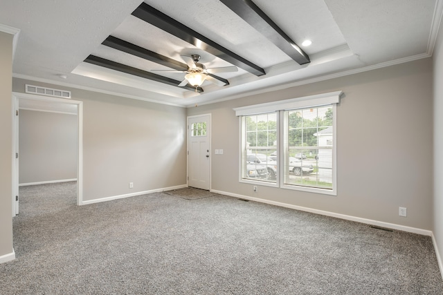 spare room featuring ceiling fan, beamed ceiling, crown molding, carpet floors, and a tray ceiling