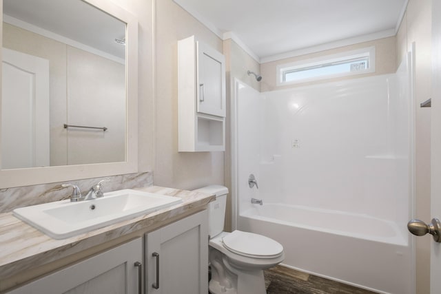 full bathroom with vanity,  shower combination, hardwood / wood-style flooring, toilet, and ornamental molding