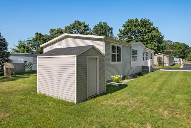 view of outdoor structure with a lawn