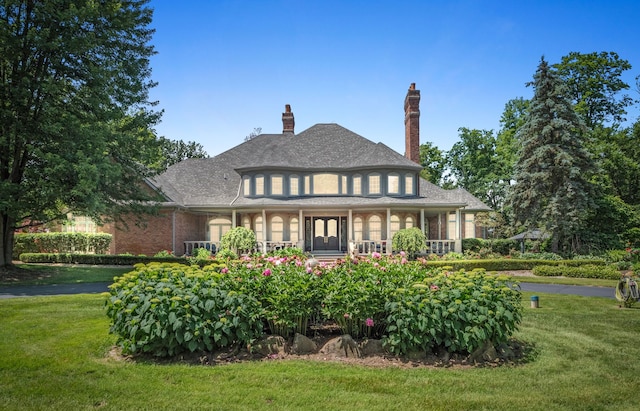 view of front facade with a porch and a front yard