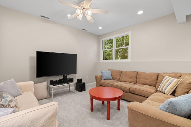 living room with light colored carpet and ceiling fan