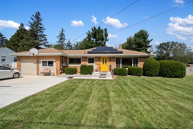 ranch-style house with solar panels and a front lawn