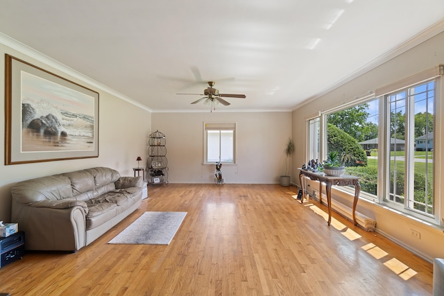 unfurnished living room with ceiling fan, light hardwood / wood-style floors, and crown molding