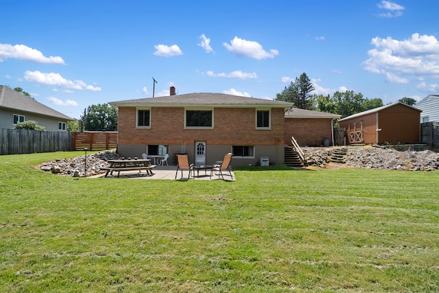 rear view of house featuring a patio, a storage shed, and a lawn