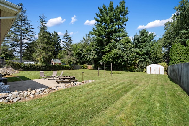 view of yard with a patio area and a shed