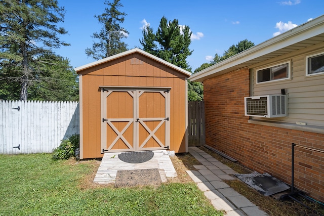 view of outdoor structure featuring a wall mounted AC