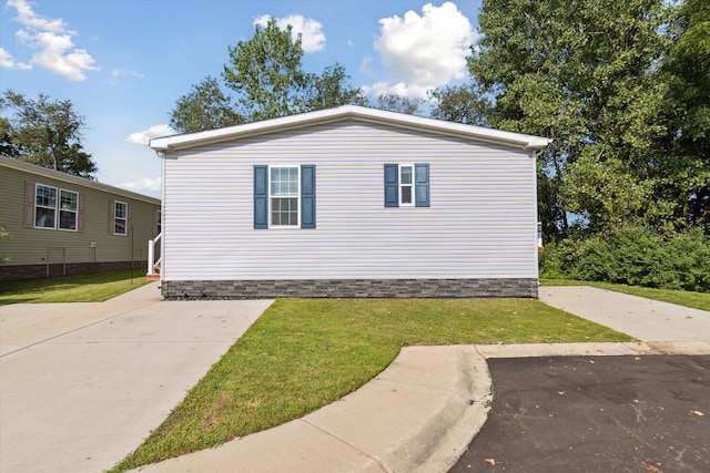 view of home's exterior with a yard