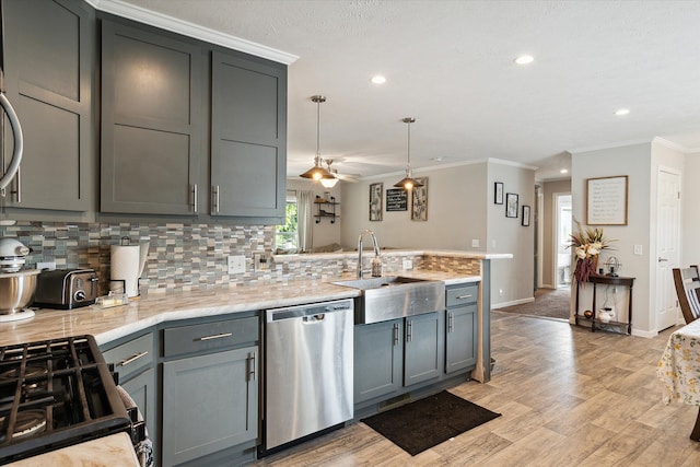 kitchen with stainless steel dishwasher, ceiling fan, crown molding, and sink