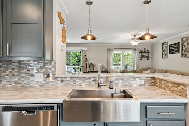 kitchen featuring tasteful backsplash, a wealth of natural light, hanging light fixtures, and stainless steel dishwasher