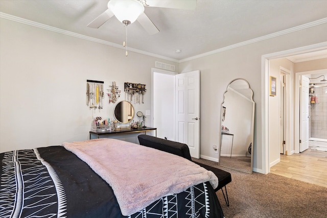 bedroom featuring carpet flooring, ceiling fan, crown molding, and ensuite bathroom