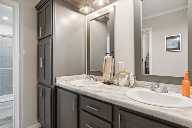 bathroom with vanity and ornamental molding