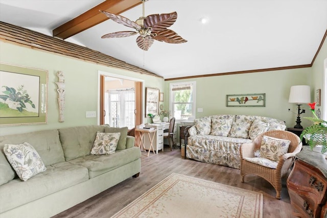 living room featuring hardwood / wood-style flooring, vaulted ceiling with beams, and ceiling fan