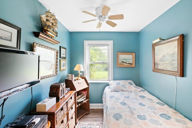 bedroom featuring light wood-type flooring and ceiling fan