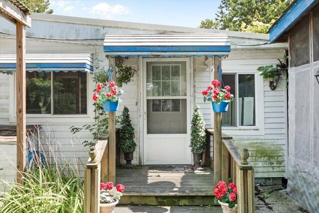 7400 Aspen Rd, Lexington, MI 48450 - doorway to property featuring a deck