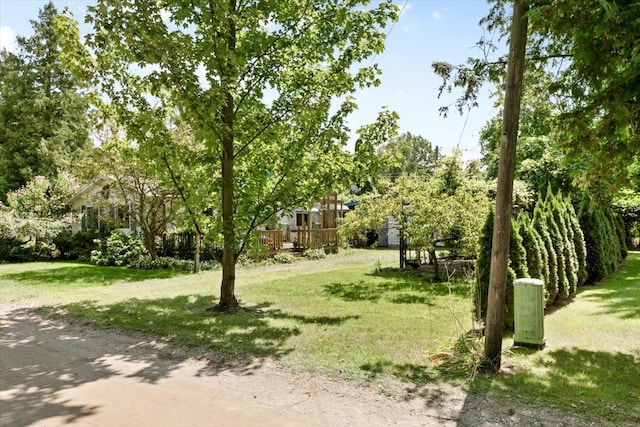 view of home's community with a yard and a deck