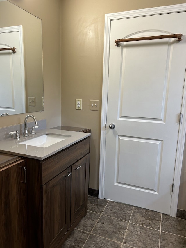 bathroom with tile patterned floors and vanity