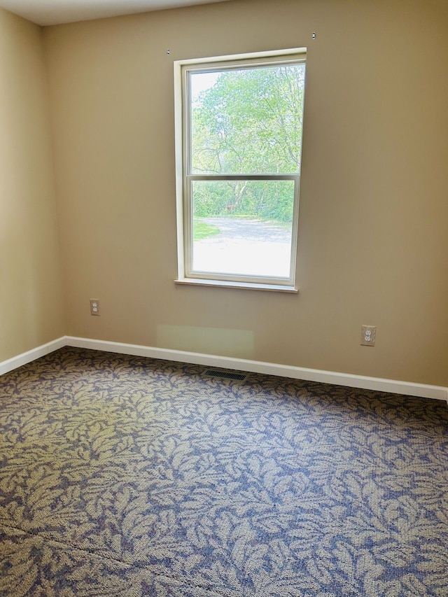 view of carpeted spare room