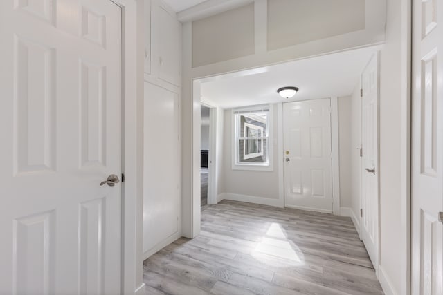 corridor featuring light hardwood / wood-style flooring