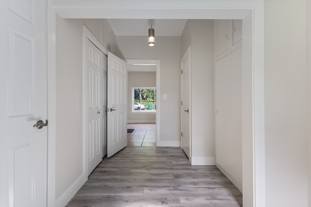 hall with light hardwood / wood-style floors