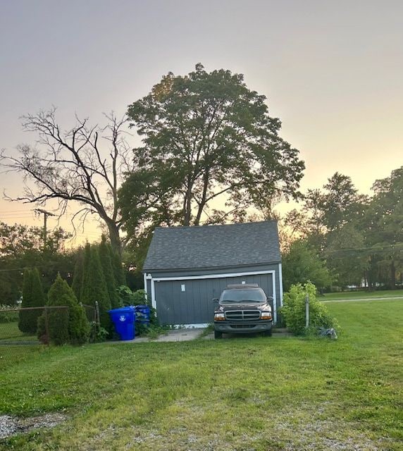 outdoor structure at dusk with a lawn