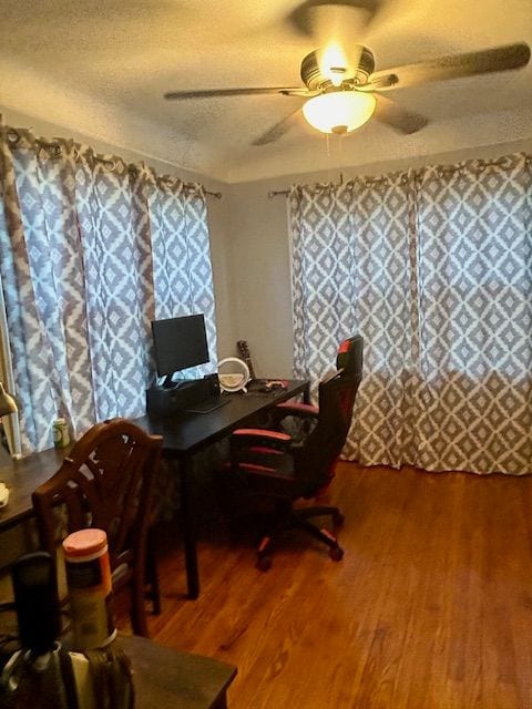 office with a textured ceiling, hardwood / wood-style flooring, and ceiling fan