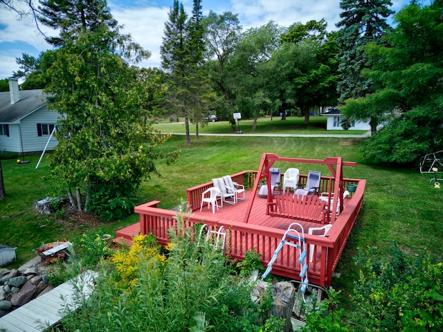 wooden deck with a lawn