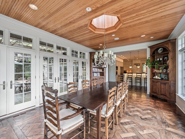 dining room featuring a chandelier, french doors, dark parquet floors, and wooden ceiling