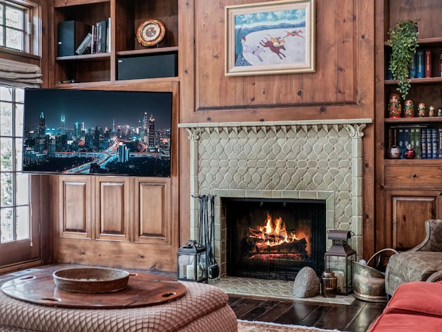 living room with hardwood / wood-style floors and a fireplace