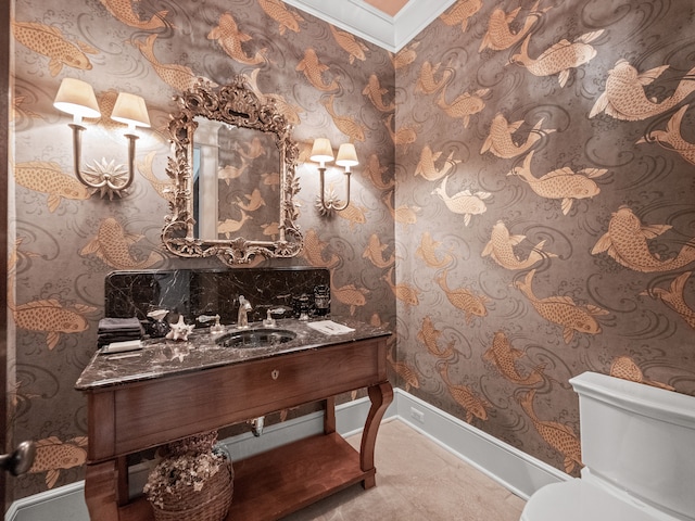 bathroom featuring vanity, toilet, and crown molding