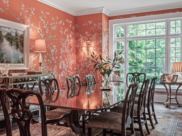 dining area featuring wood-type flooring and ornamental molding