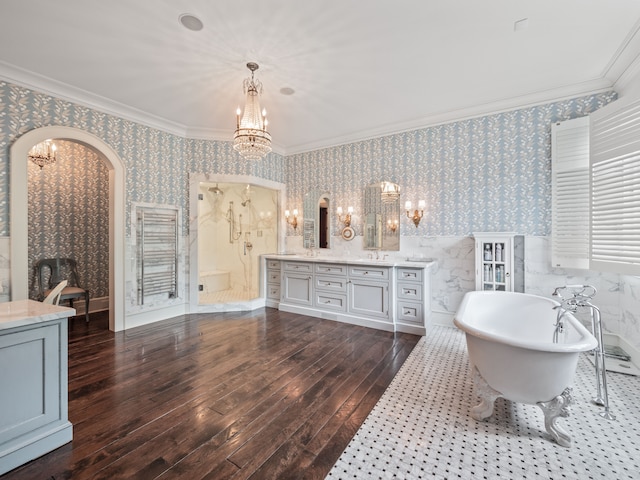 bathroom featuring hardwood / wood-style floors, vanity, independent shower and bath, and crown molding