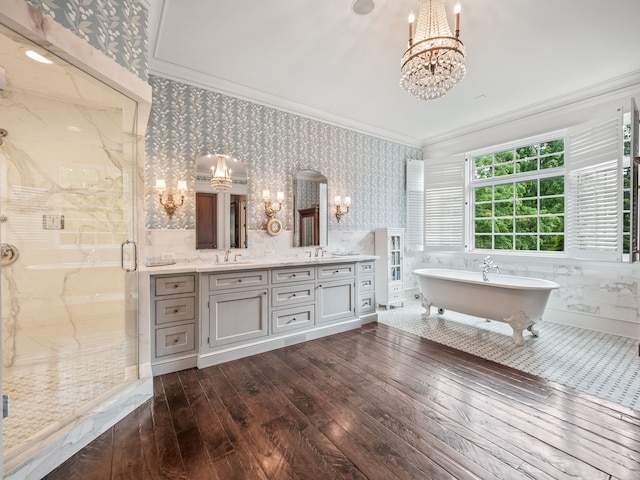 bathroom with hardwood / wood-style flooring, vanity, separate shower and tub, and ornamental molding