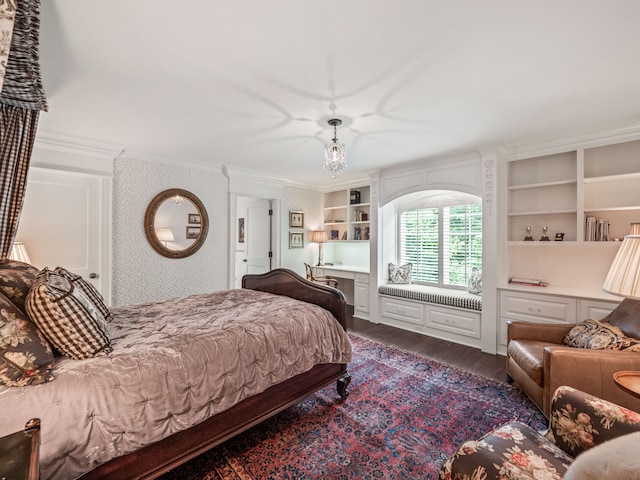 bedroom featuring wood-type flooring and crown molding