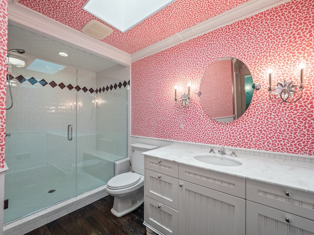 bathroom featuring hardwood / wood-style floors, an enclosed shower, toilet, vanity, and ornamental molding