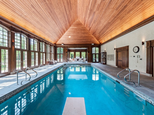 view of swimming pool featuring a diving board