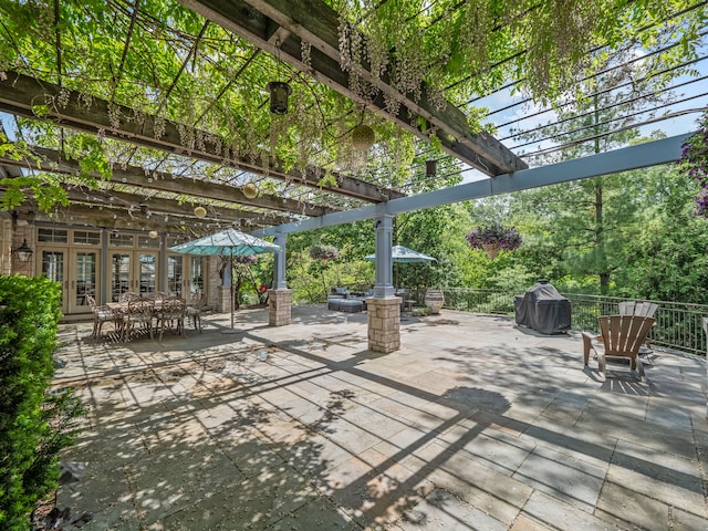 view of patio featuring a pergola and french doors