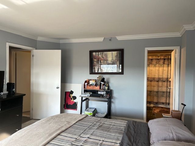 bedroom featuring crown molding