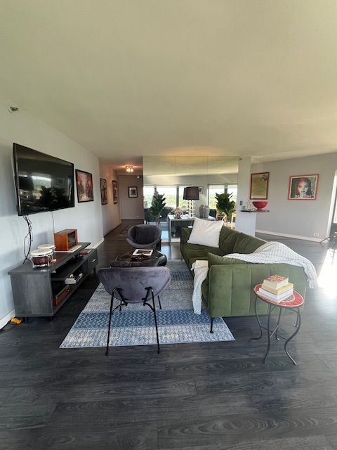 living room with dark wood-type flooring