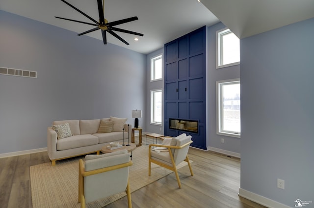 4911 Skylark Dr, Monroe, MI 48161 - living area featuring baseboards, visible vents, ceiling fan, and light wood-style floors