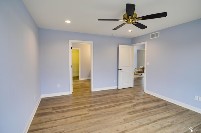 unfurnished bedroom with light hardwood / wood-style floors and ceiling fan