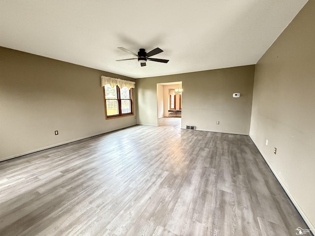 unfurnished room with ceiling fan and light hardwood / wood-style flooring