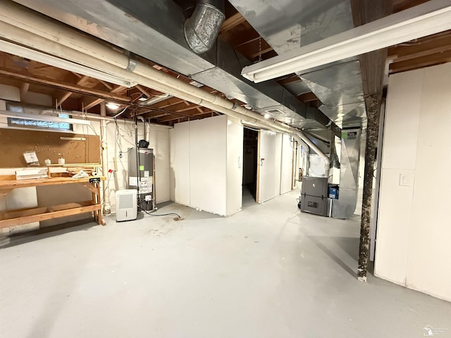 basement featuring heating unit and gas water heater