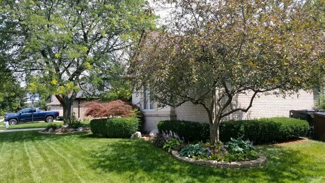 48280 Elmwood Dr, Shelby Twp, MI 48315 - view of side of home with a lawn