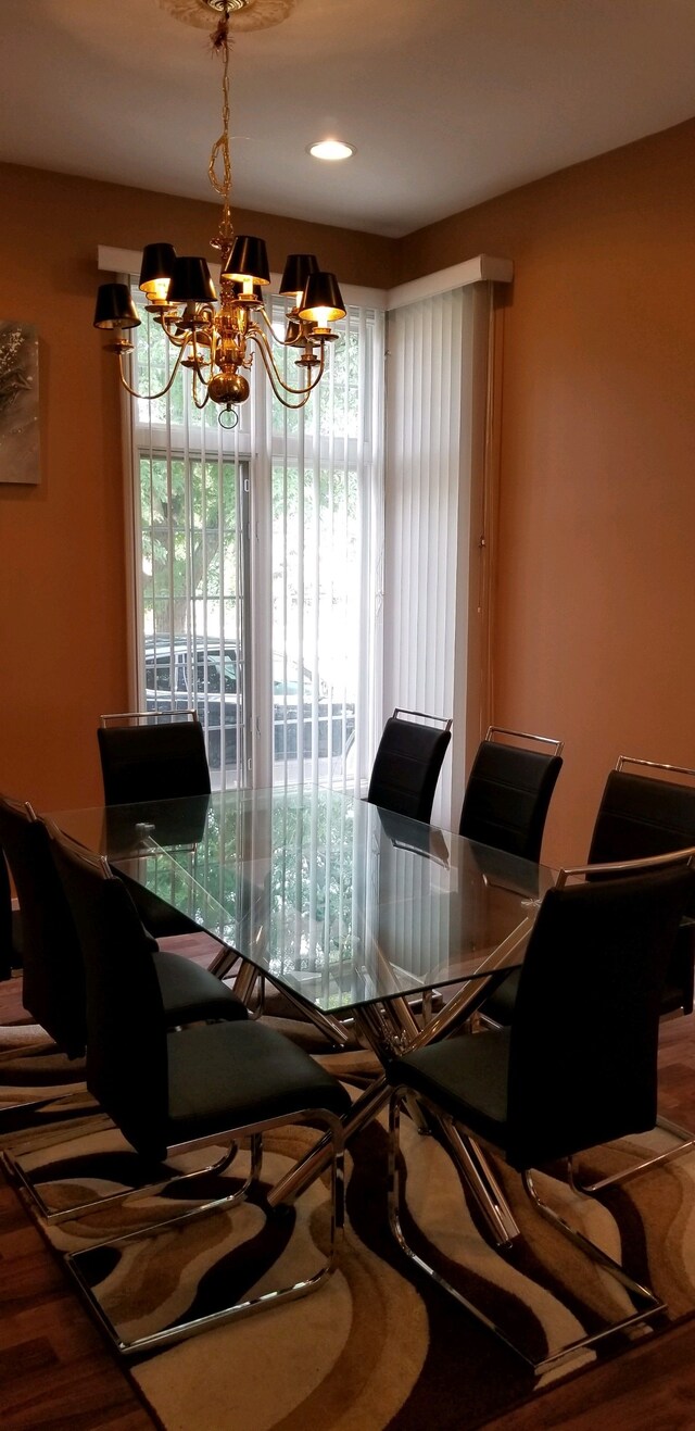 48280 Elmwood Dr, Shelby Twp, MI 48315 - dining space featuring a chandelier and wood finished floors