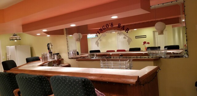 48280 Elmwood Dr, Shelby Twp, MI 48315 - bar with white fridge with ice dispenser, recessed lighting, and a sink