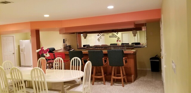 48280 Elmwood Dr, Shelby Twp, MI 48315 - bar area featuring white fridge with ice dispenser, carpet floors, and recessed lighting