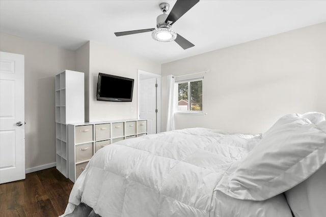 bedroom featuring ceiling fan and dark hardwood / wood-style flooring